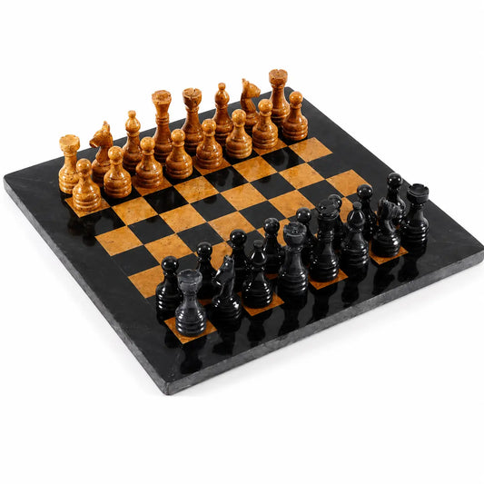 A polished black and warm brown checkered chessboard with black and brown wooden chess pieces arranged on a white studio background.