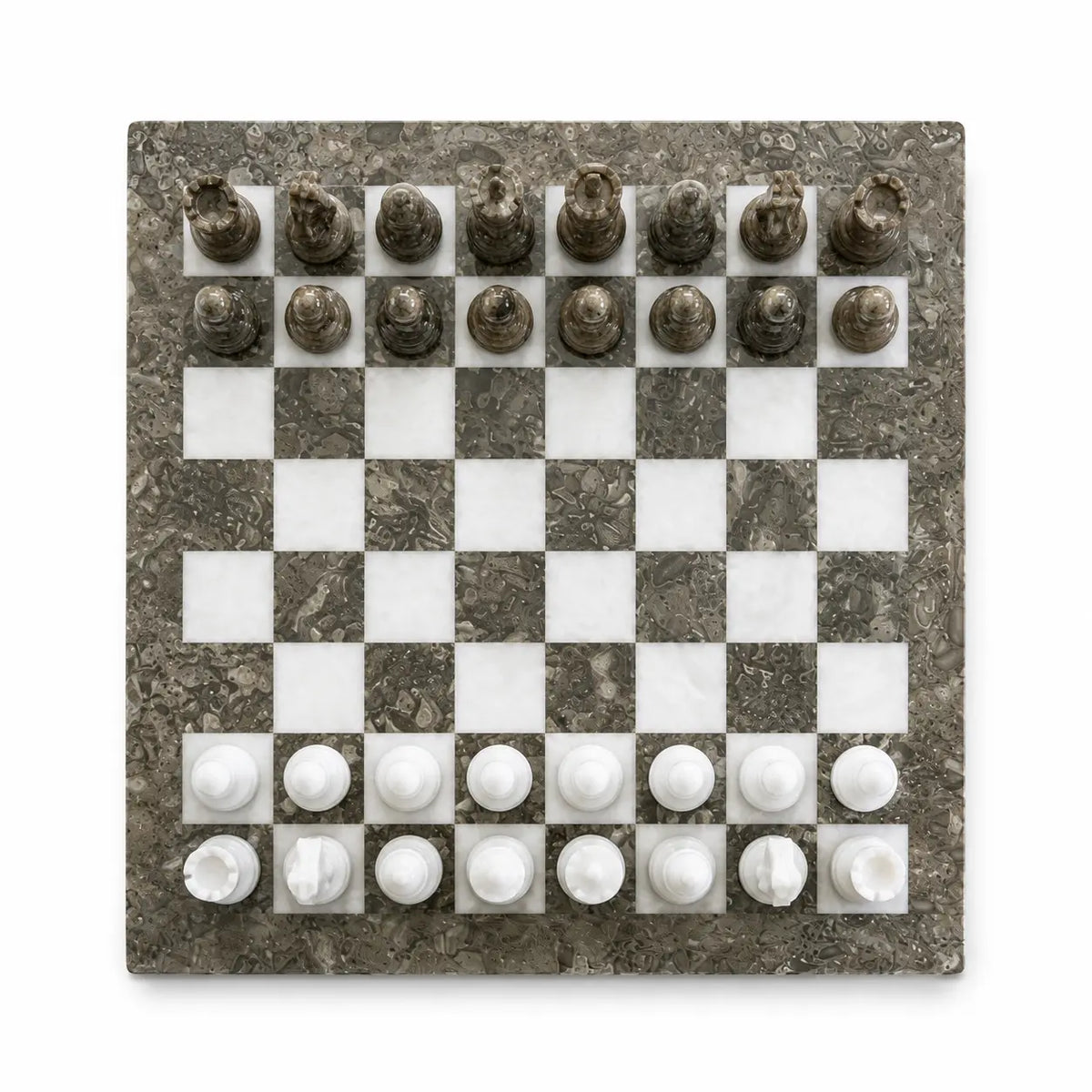 A square marble chessboard with a dark gray and white checkered pattern, featuring white and dark gray chess pieces arranged in their starting positions, shown from a top-down view on a white background.